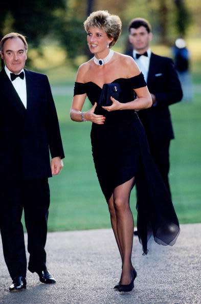 <div class="inline-image__caption"><p>Lord Palumbo greets Princess Diana, wearing a short black cocktail dress designed by Christina Stambolian, as she attends a gala at the Serpentine Gallery in Hyde Park on June 29, 1994, in London.</p></div> <div class="inline-image__credit">Tim Graham Photo Library via Getty</div>