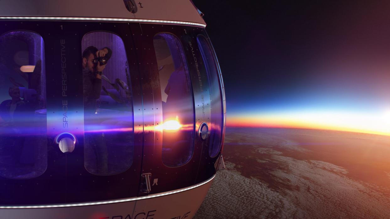 An illustration of a man taking a sunset photo in a space cabin above earth's atmosphere