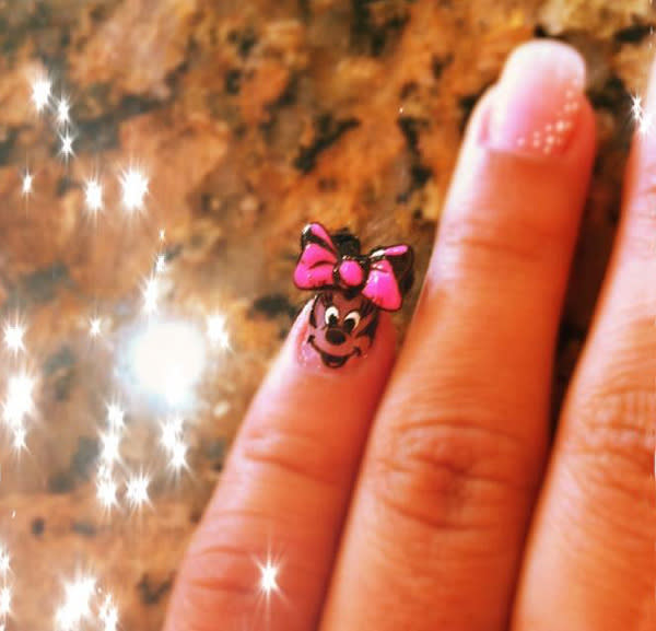 <div class="caption-credit"> Photo by: Bebe</div>Bebe's pinky is Minnie! Mouse that is, complete with bow.