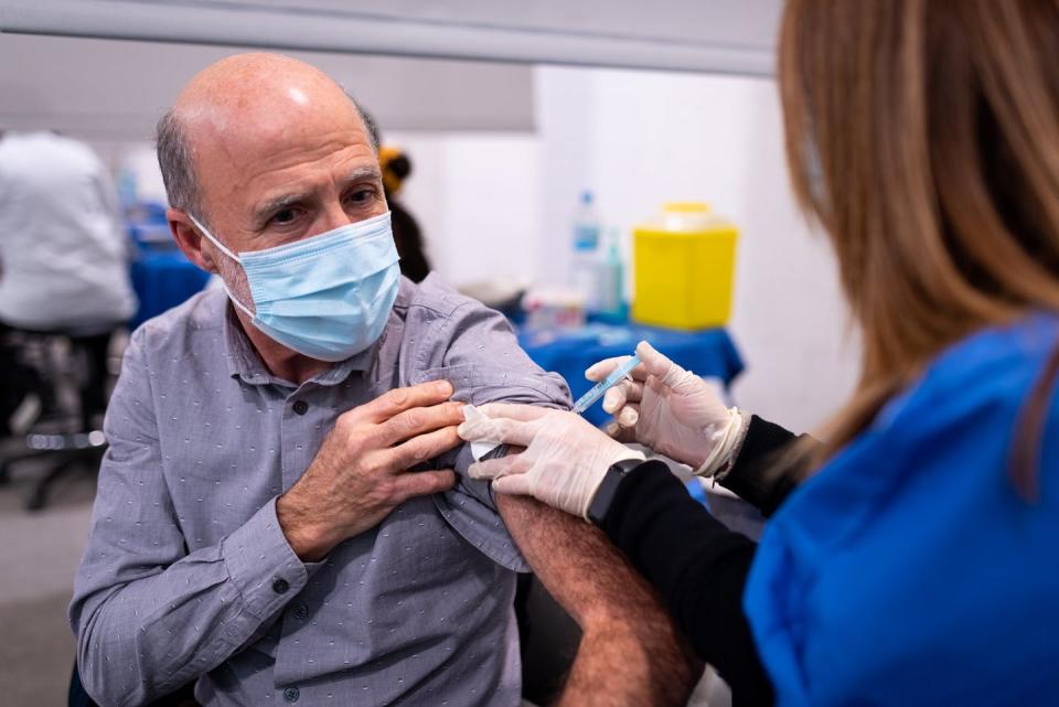 <span class="caption">Adjuvanted vaccines boost older people’s immune systems to better protect against the flu.</span> <span class="attribution"><a class="link " href="https://www.shutterstock.com/image-photo/old-man-receives-booster-shot-covid-2097158878" rel="nofollow noopener" target="_blank" data-ylk="slk:Shutterstock;elm:context_link;itc:0;sec:content-canvas">Shutterstock</a></span>