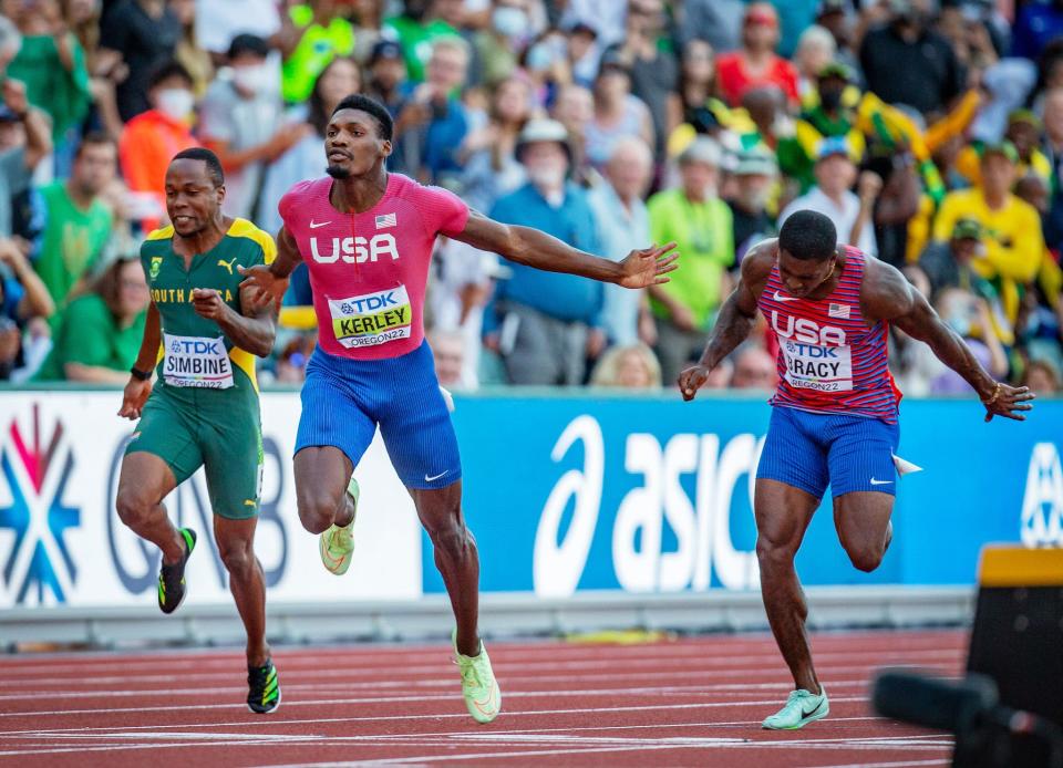 Fred Kerley, center, takes the gold and Marvin Bracy, right, the silver in the 100 meters at the World Championships on Saturday in Eugene, Oregon.