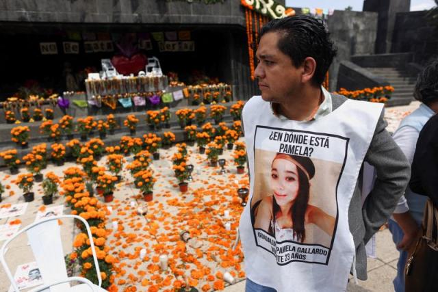 FILE PHOTO: Mexicans pay tribute to the murdered joranlists and activists on the eve of the Day of the Dead