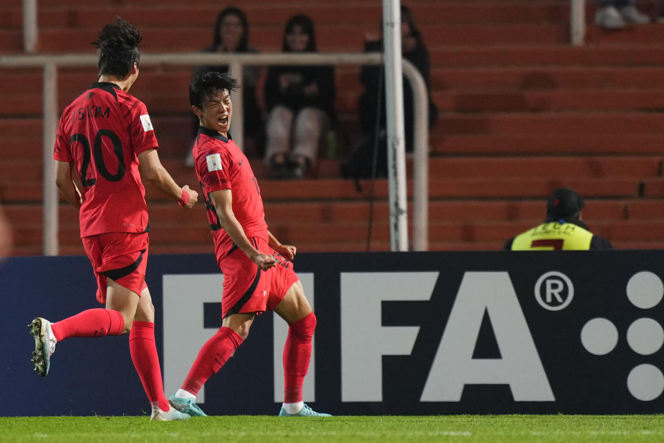 South Korea's Park Seung-ho, right, celebrates scoring his side's second goal during a FIFA U-20 World Cup Group F soccer match against Honduras at the Malvinas Argentinas stadium in Mendoza, Argentina, Thursday, May 25, 2023. (AP Photo/Natacha Pisarenko)