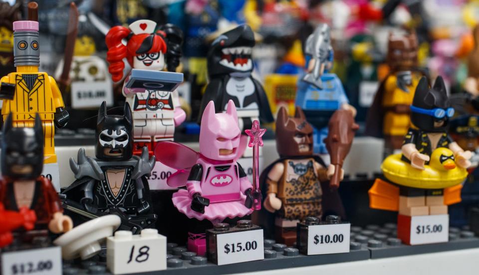 Various Lego minifigures sit for sale Monday, Nov. 29, 2021, inside It's A Block Party in Indianapolis. The store specializes in Lego products, selling sets and individual pieces by the cup or pound. They also purchase Lego sets. 