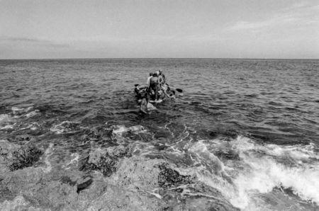 Would-be emigrants launch a makeshift boat into the Straits of Florida towards the U.S., on the last day of the 1994 Cuban Exodus in Havana, September 13, 1994. REUTERS/Rolando Pujol Rodriguez