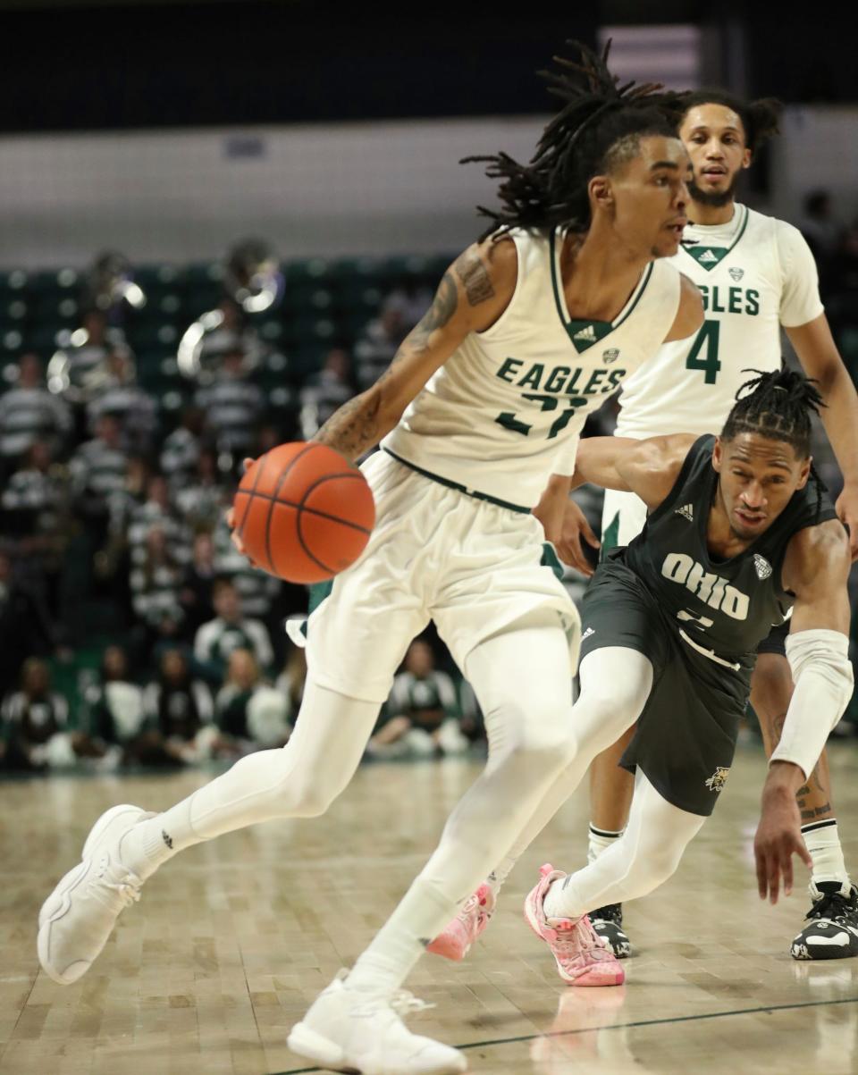 Eastern Michigan Eagles forward Emoni Bates scores against Ohio Bobcats guard Miles Brown during the second half Tuesday, Jan. 31, 2023 in Ypsilanti.

Emuoh 013123 Kd1257