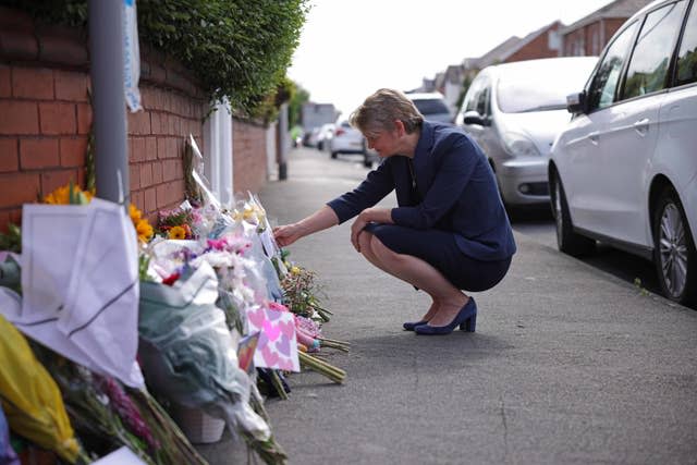 Home Secretary Yvette Cooper looks at tributes 