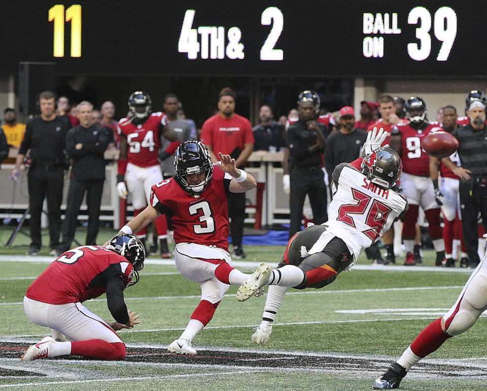 Atlanta Falcons kicker Matt Bryant (3) boots a field goal against the Tampa Bay Buccaneers during the final minutes of the fourth quarter of an NFL football game on Sunday, Oct 14, 2018, in Atlanta. Bryant left the field after the kick with an apparent injury. (Curtis Compton/Atlanta Journal-Constitution via AP)