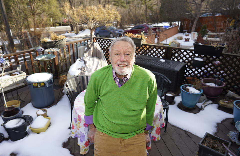 Howard Jones, an 83-year-old veteran, talks about his struggle to secure a COVID-19 vaccination in El Paso County while seated on the deck outside his home Tuesday, Jan. 12, 2021, in southwest Colorado Springs, Colo. Not having internet in his home, Jones ended up getting help from a friend to get an appointment for the vaccine in Colorado Springs.(AP Photo/David Zalubowski)