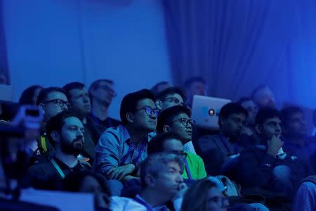 Attendees watch during a keynote on the second day of the annual Facebook F8 developers conference in San Jose, California, U.S., April 19, 2017. REUTERS/Stephen Lam