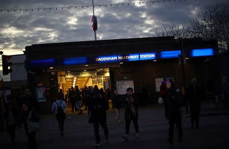 Commuters leave Dagenham Heathway underground station in Dagenham, east London, Britain, March 18, 2019. REUTERS/Hannah McKay