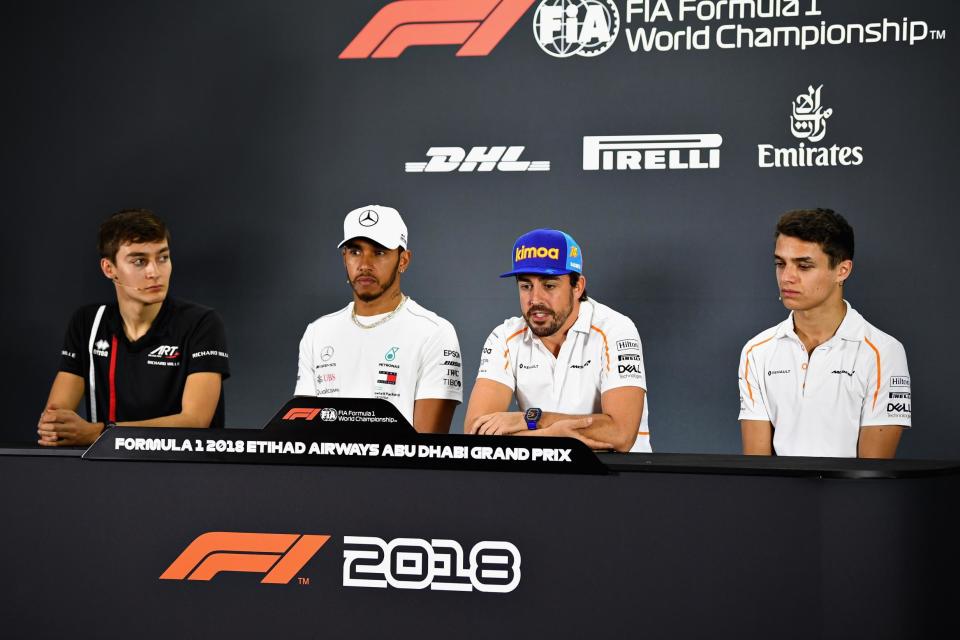 (L-R) George Russell listens to Lewis Hamilton and Fernando Alonso, along with fellow rookie Lando Norris, who will drive with McLaren in 2019 Photo: Getty Images