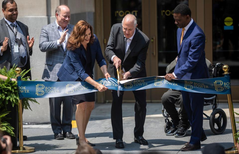 Councilmember Coleman A. Young II, left, Mayor Mike Duggan, Gov. Gretchen Whitmer, Randall Book, and Kofi Bonner, CEO of Bedrock LLC, cut the ribbon during downtown Detroit's Book Tower ribbon-cutting ceremony on Thursday, June 8, 2023.