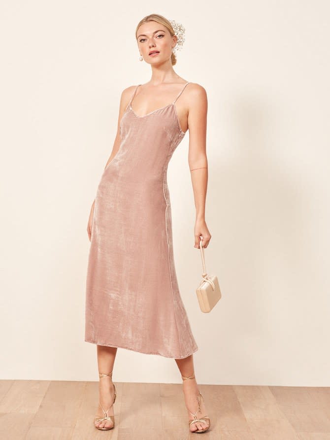 <em><strong>Shop Now:</strong> Reformation Gaia Dress, $278. <a rel="nofollow noopener" href="https://www.thereformation.com/products/gaia-dress?color=Caviar" target="_blank" data-ylk="slk:thereformation.com;elm:context_link;itc:0;sec:content-canvas" class="link ">thereformation.com</a>.</em>