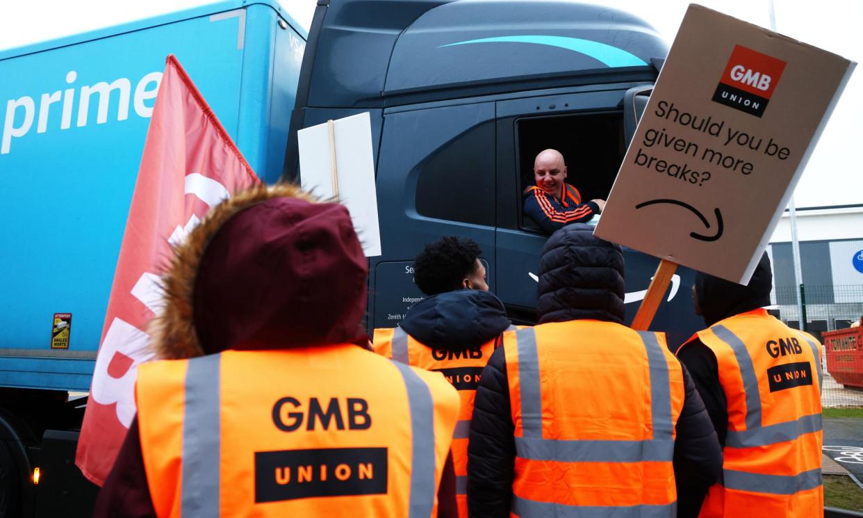 <span>Amazon workers strike over pay at a fulfilment centre in Coventry, UK.</span><span>Photograph: Bloomberg/Getty</span>