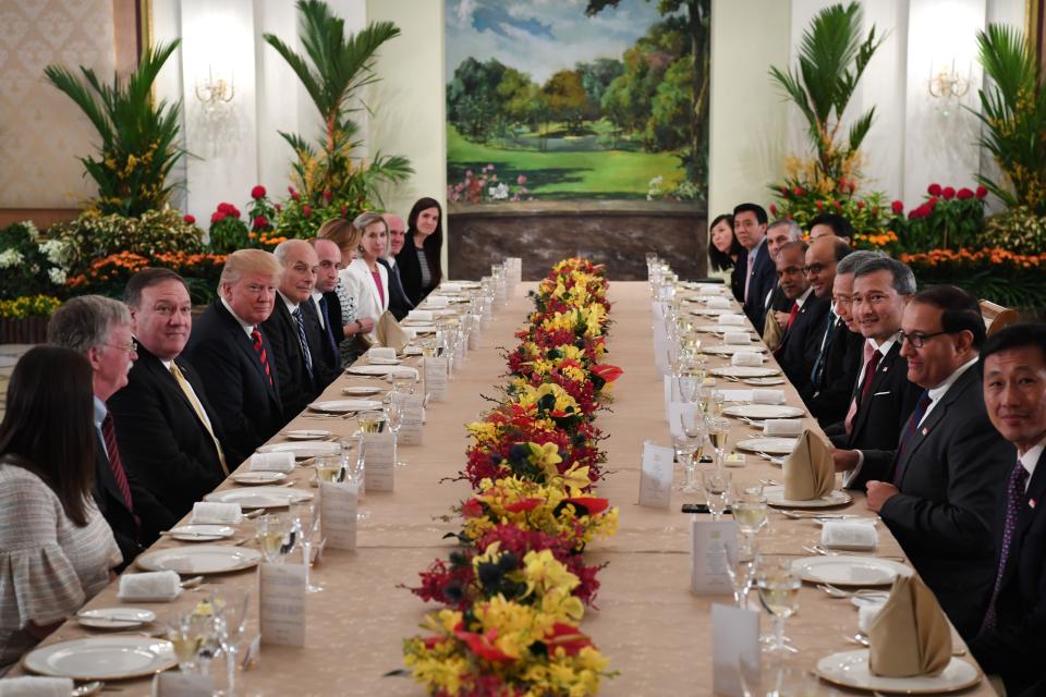 President Donald Trump and his delegation share a working lunch Singapore's Prime Minister Lee Hsien Loong (4th R) and his team during the U.S. leader's visit to Singapore on June 11, 2018.