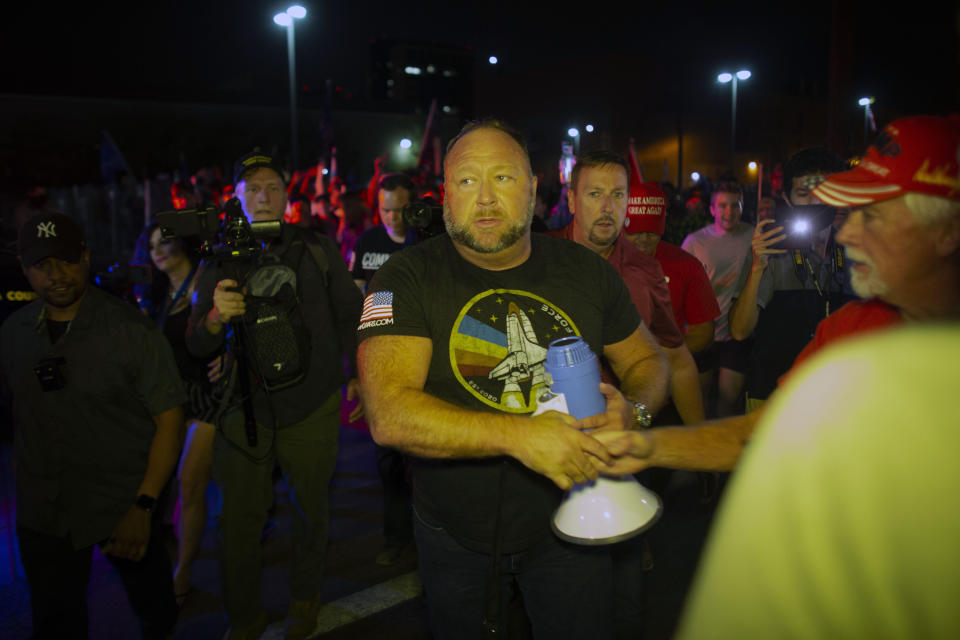 After making a violent speech outside the elections center on Thursday night, far-right radio host Alex Jones returned the next night, Nov. 6, 2020, to rile up the crowd again. (Photo: AP Photo/Dario Lopez-MIlls)