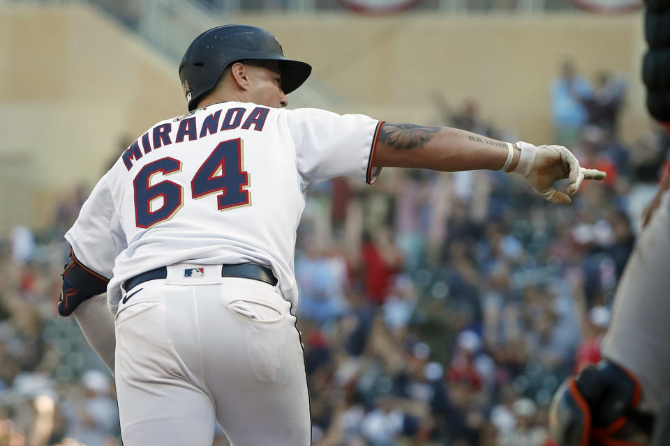 RETRANSMISSION TO CORRECT ID TO JOSE MIRANDA - Minnesota Twins' Jose Miranda points to the bench as he runs and celebrates his walk off single against the Baltimore Orioles in the ninth inning of a baseball game Saturday, July 2, 2022, in Minneapolis. The Twins won 4-3. (AP Photo/Bruce Kluckhohn)