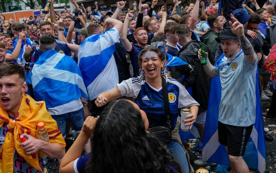 Scotland fans gather in Leicester Square prior to the Euro 2020 soccer championship group D match between England and Scotland, in London - Kirsty Wigglesworth/AP