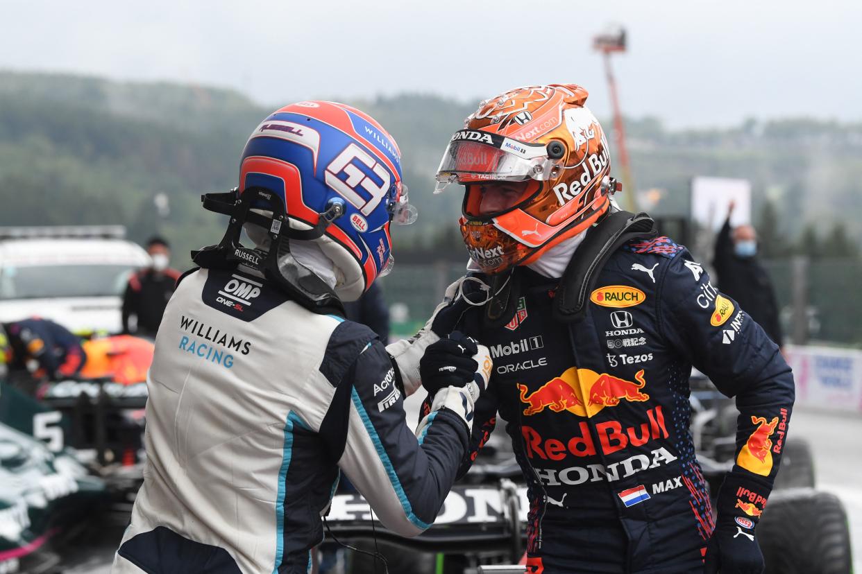 Red Bull driver Max Verstappen (R) celebrates with second-placed Williams' British driver George Russell.