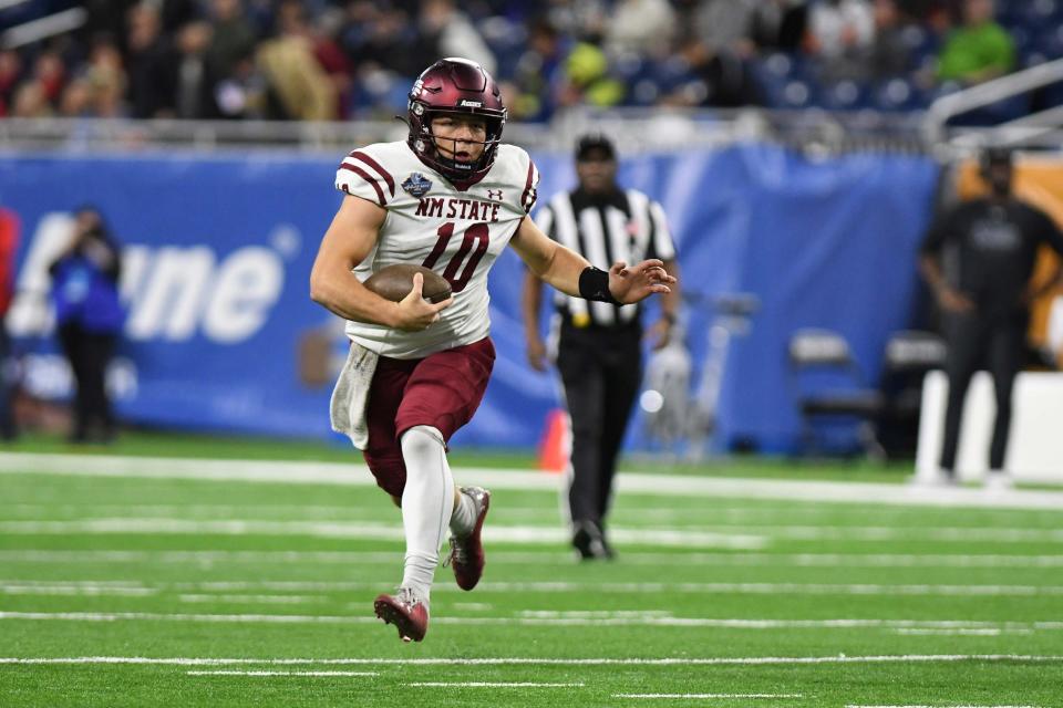 Dec 26, 2022; Detroit, Michigan, USA; New Mexico State quarterback Diego Pavia (10) scrambles for a first down against Bowling Green in the first quarter in the 2022 Quick Lane Bowl at Ford Field.