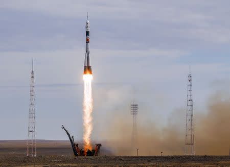 The Soyuz TMA-18M spacecraft carrying the crew of Aidyn Aimbetov of Kazakhstan, Sergei Volkov of Russia and Andreas Mogensen of Denmark blasts off from the launch pad at the Baikonur cosmodrome, Kazakhstan, September 2, 2015. REUTERS/Shamil Zhumatov