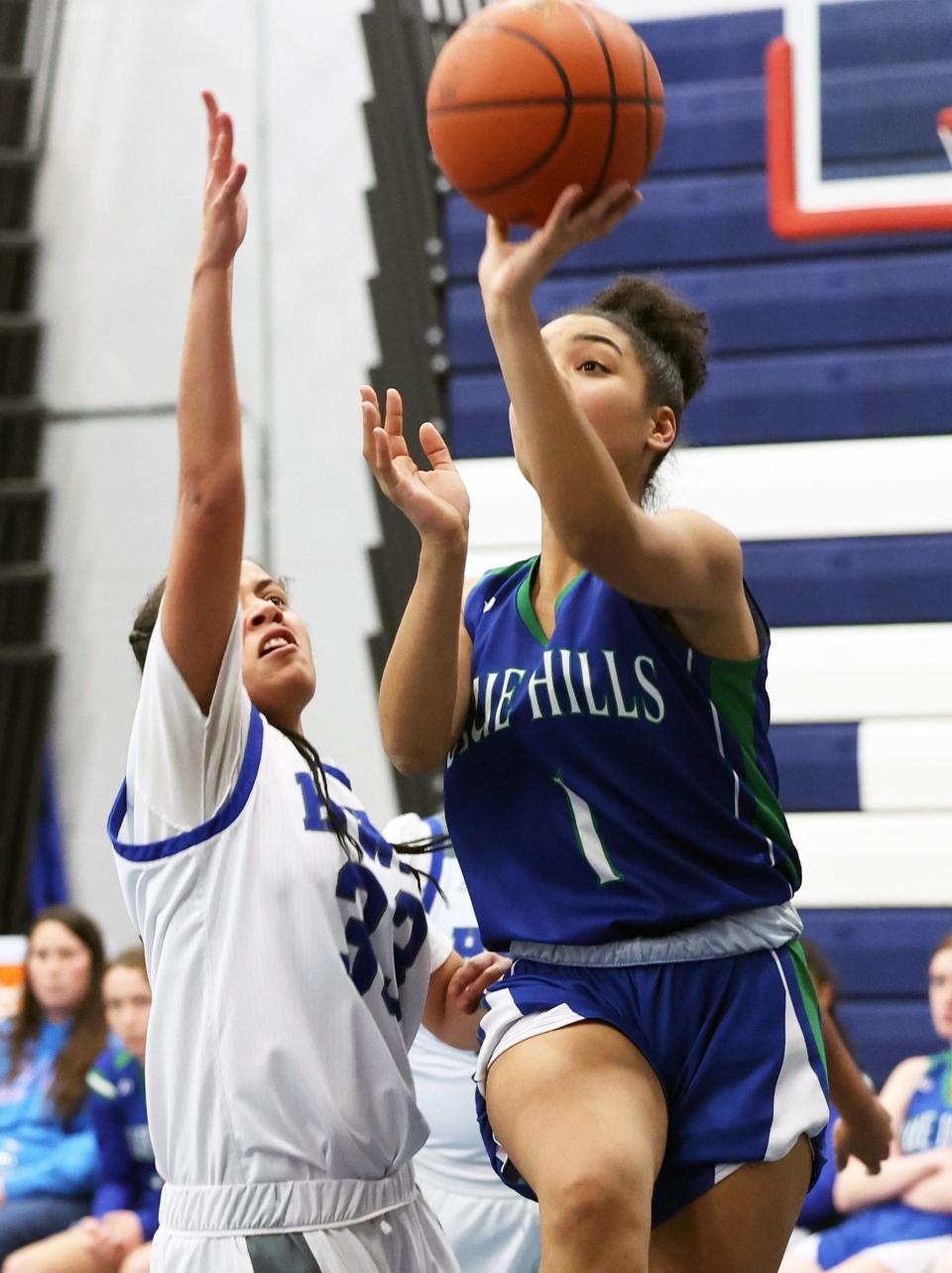 Blue Hills Keira McMartin scores a basket on Southeastern defender Ahri DePina during a game on Wednesday, Jan. 11, 2023.