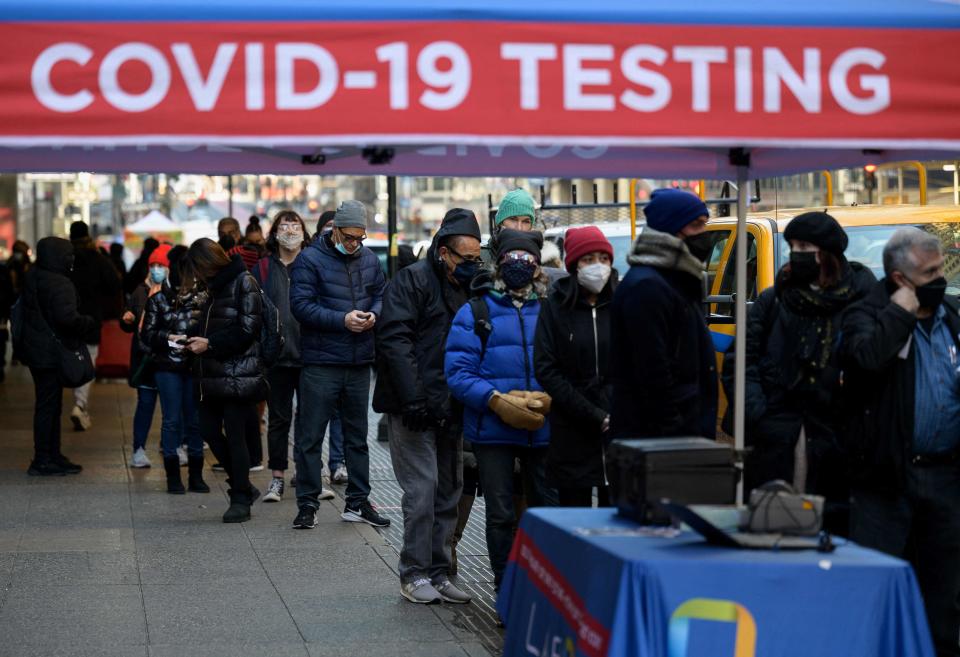 People wait in line to receive a COVID-19 test on Jan. 4, 2022, in New York City.