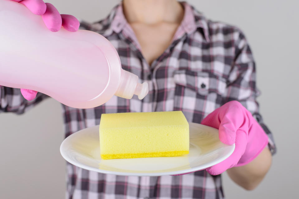 Woman cleaning sponge