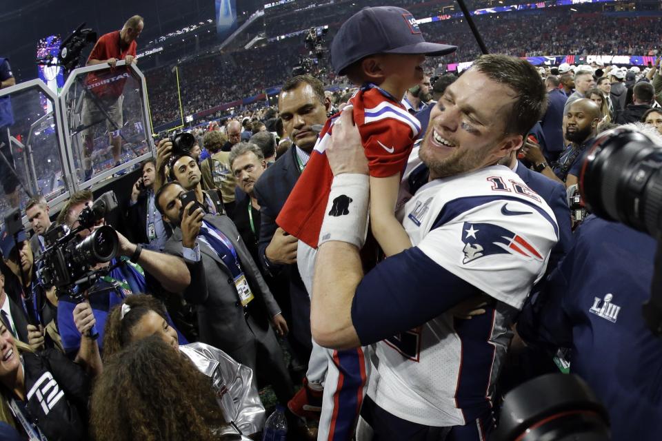 <p>New England Patriots’ Tom Brady lifts his son, Ben, after the NFL Super Bowl 53 football game against the Los Angeles Rams, Sunday, Feb. 3, 2019, in Atlanta. The Patriots won 13-3. (AP Photo/Mark Humphrey) </p>