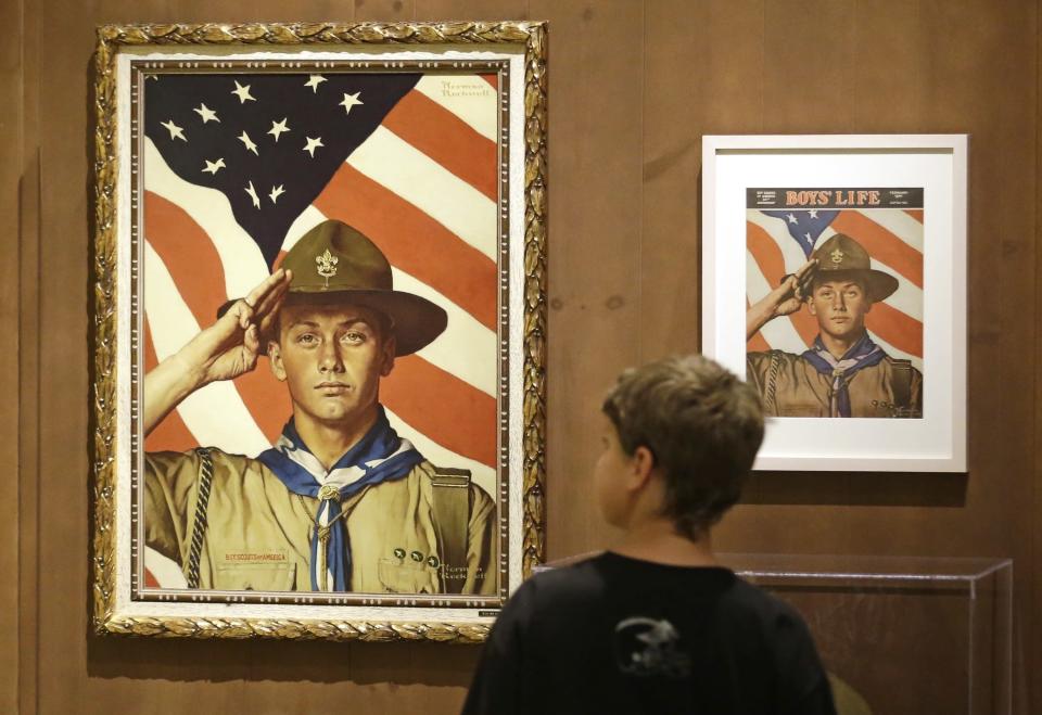 In this July 22, 2013, file photo, a youth looks over the Rockwell exhibition in Salt Lake City. (Photo: Rick Bowmer/AP)