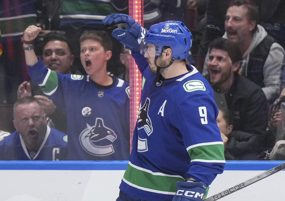 Vancouver Canucks' J.T. Miller celebrates his goal against the Carolina Hurricanes during the second period of an NHL hockey game Saturday, Dec. 9, 2023, in Vancouver, British Columbia. (Darryl Dyck/The Canadian Press via AP)