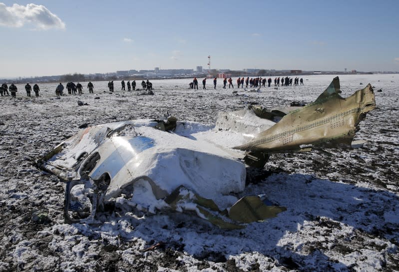 FILE PHOTO: Emergencies Ministry members work at the crash site of a Boeing 737-800 Flight FZ981 operated by Dubai-based budget carrier Flydubai, at the airport of Rostov-On-Don