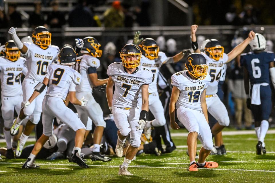 Grand Ledge celebrates after recovering an East Lansing fumble on a kickoff during the fourth quarter on Friday, Oct. 21, 2022, at East Lansing High School.