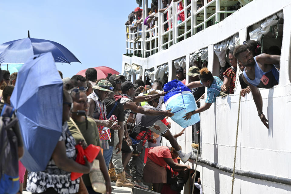 Voters board the already overcrowded Fair Glory ferry in Honiara, Solomon Islands, Saturday, April 13, 2024, heading to Malaita Island to vote in a national election. The country in which China has gained most influence in the South Pacific, Solomon Islands, goes to the polls on Wednesday in an election that could shape the region's future. (Mick Tsikas/AAP Image via AP)