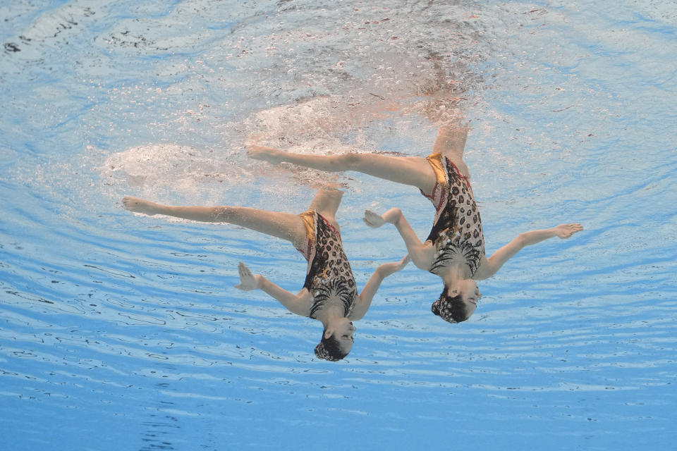 Wang Liuyi and Wang Qianyi, of China, compete in the women's duet free final of artistic swimming at the World Aquatics Championships in Doha, Qatar, Thursday, Feb. 8, 2024. (AP Photo/Lee Jin-man)