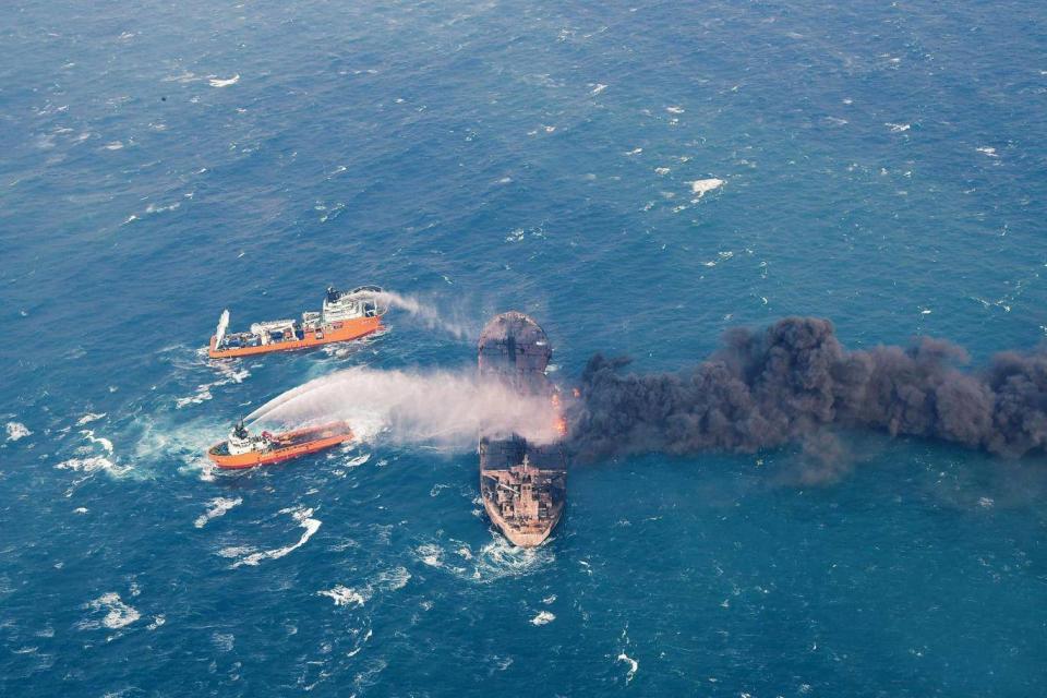 Firefighting boats work to put out a blaze on the oil tanker Sanchi (AP)