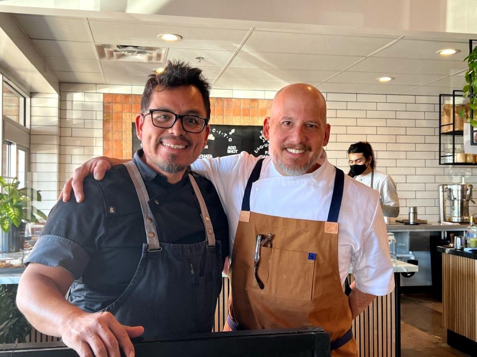 Carlos Diaz (L) and Doug Robson (R) pose for a photo.