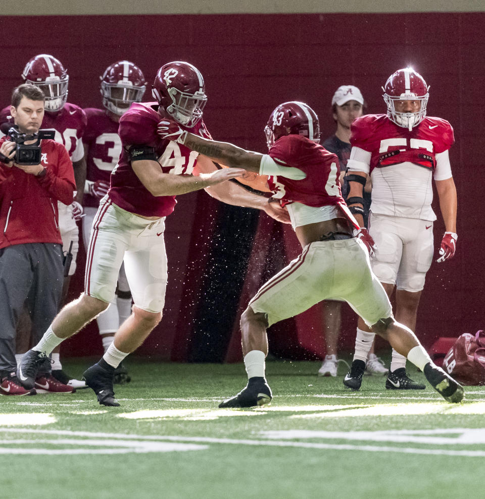 Alabama linebacker Keith Holcombe (42) and linebacker VanDarius Cowan (43) work through drills during football practice, Wednesday, Dec. 20, 2017, at the Hank Crisp Indoor Facility in Tuscaloosa, Ala. (Vasha Hunt/AL.com via AP)