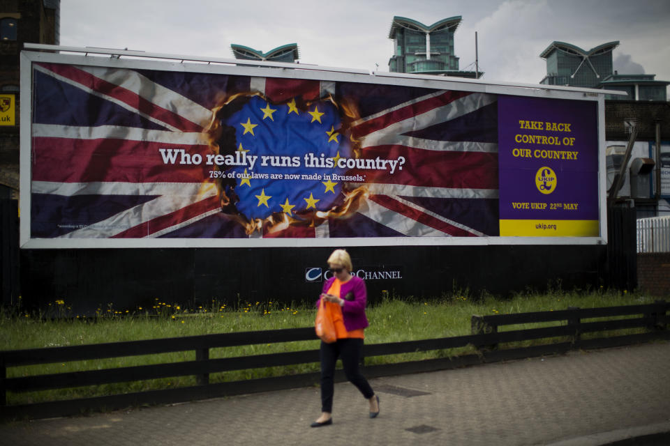 A UKIP European election billboard is displayed in the Vauxhall area of London, Tuesday, April 22, 2014. Britain's U.K. Independence Party has launched its European election campaign with a series of billboards carrying a stark message: They are coming to take your job. "They" is workers from other European Union countries, who have the right to live in Britain. Party leader Nigel Farage said Tuesday that the posters were "a hard-hitting reflection of reality." But others are calling them xenophobic. (AP Photo/Matt Dunham)