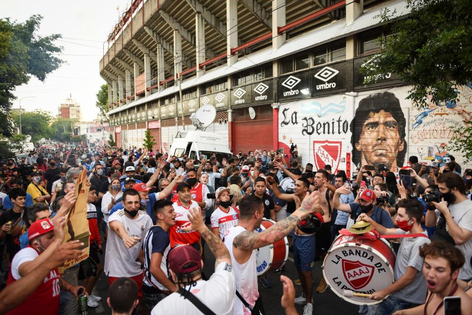 <p>People gather to mourn the death of Diego Maradona outside the Diego Armando Maradona stadium in Buenos Aires</p>REUTERS