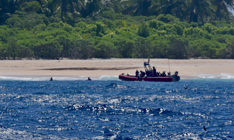 The crew of USCGC Oliver Henry rescues three mariners stranded on Pikelot Atoll, Yap State, Federated States of Micronesia (U.S. Coast Guard)