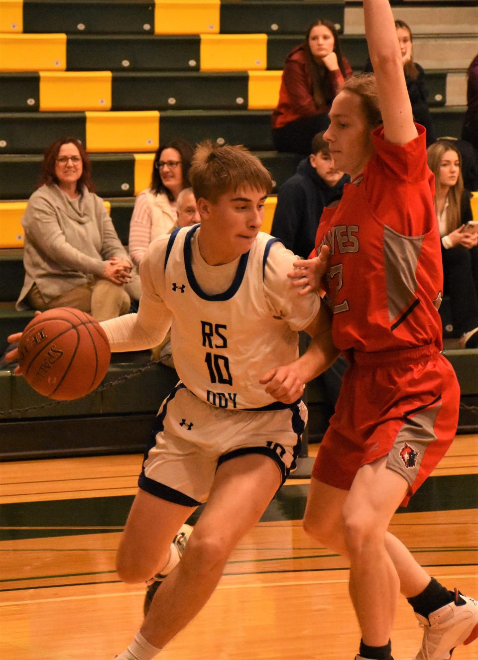 Richfield Springs/Owen D. Young's Justin Wolfe (left) drives against Oppenheim-Ephratah-St. Johnsville defender Jacob Walrath at Herkimer College Jan. 13. Wolfe and the Eagles open postseason play on the road in Section IV Wednesday afternoon.