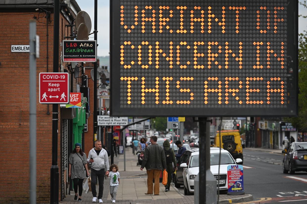 A public health digital board warns the public of a Covid-19 variant of concern affecting the community in Bolton, northwest England on May 14, 2021. - England remains on track for the latest easing of its coronavirus lockdown next week but is taking no chances after a doubling of cases of an Indian variant, the government said today. (Photo by Oli SCARFF / AFP) (Photo by OLI SCARFF/AFP via Getty Images)