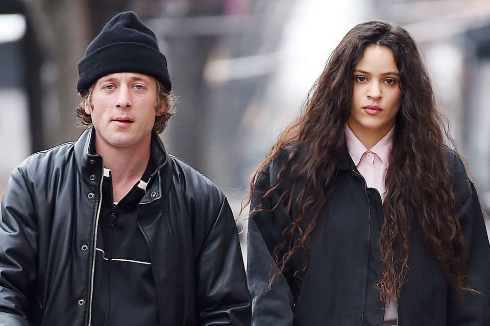 <p>TheImageDirect.com</p> Jeremy Allen White and Rosalía out on a walk together in New York City on Jan. 3, 2024.