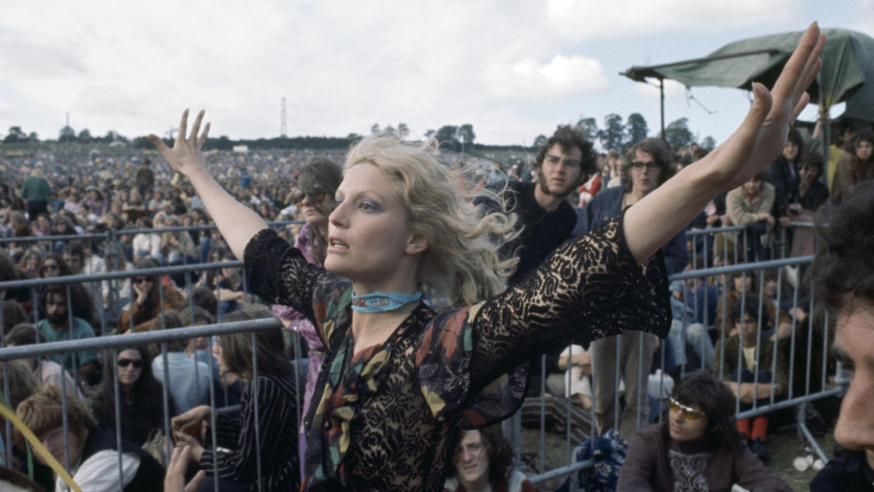  BATH, ENGLAND - JUNE 27: A female fan in the crowd attending the Bath Festival of Blues and Progressive Music at the Royal Bath and West Showground in Shepton Mallet, England on 27 June, 1970.  