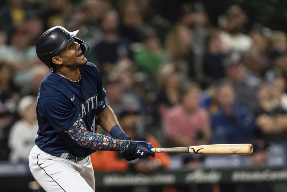 Seattle Mariners' Julio Rodriguez hits a bloop single off Detroit Tigers starting pitcher Bryan Garcia during the third inning of a baseball game, Monday, Oct. 3, 2022, in Seattle. (AP Photo/Stephen Brashear)