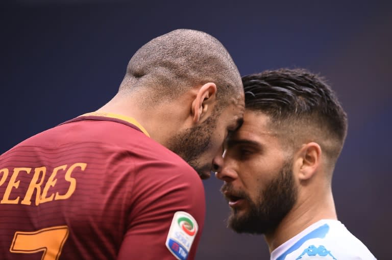 Roma's defender Bruno Peres (L) argues with Napoli's midfielder Lorenzo Insigne during the Italian Serie A football match March 4, 2017