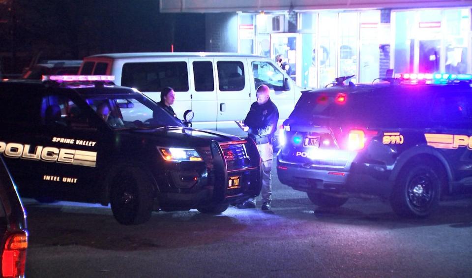 Spring Valley police cars in front of laundromat investigating shooting (April 9, 2024)