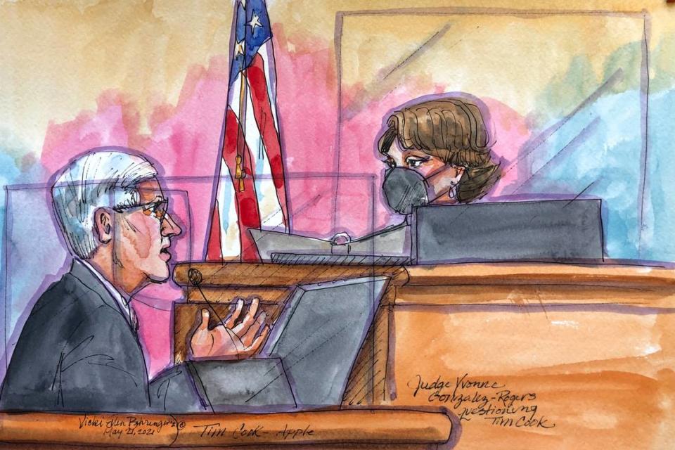 This courtroom sketch shows Apple CEO Tim Cook being questioned by U.S. District Court Judge Yvonne Gonzalez Rogers during a trial in San Ramon, Calif., on Friday, May 21, 2021. Cook described the company’s ironclad control over its mobile app store as a way to keep things simple for customers while protecting them against security threats and privacy intrusions during Friday testimony denying allegations he has been running an illegal monopoly. The rare courtroom appearance by one of the world’s best-known executives came during the closing phase of a three-week trial revolving an antitrust case brought by Epic Games, maker of the popular video game Fortnite. (Vicki Behringer via AP)